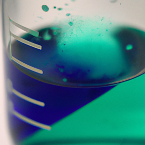 A close-up of a blue and green colored chemical compound in a beaker.