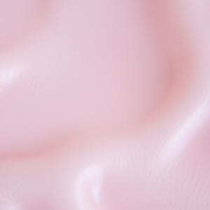 A close-up of a pink, smooth, and clear skin surface.