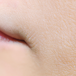 A close-up of smooth, unblemished skin with a bright, natural light.